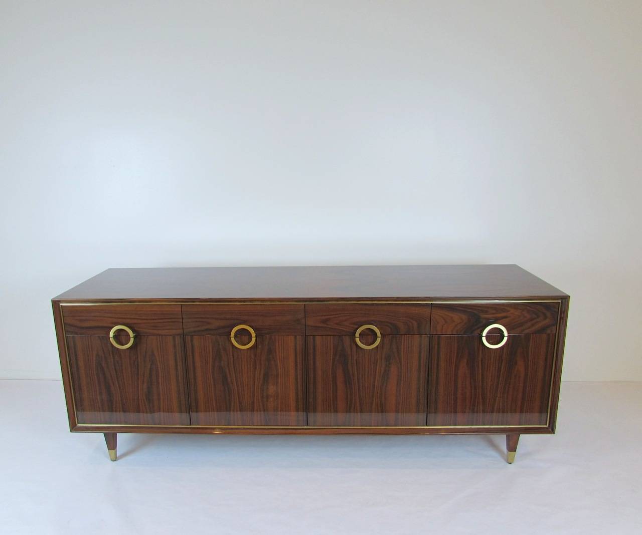 Doug Levine for HH Ruseau Anneau Cabinet in high, gloss lacquered rosewood with brass details. Solid wood interior, with soft-close drawers, and finished back.