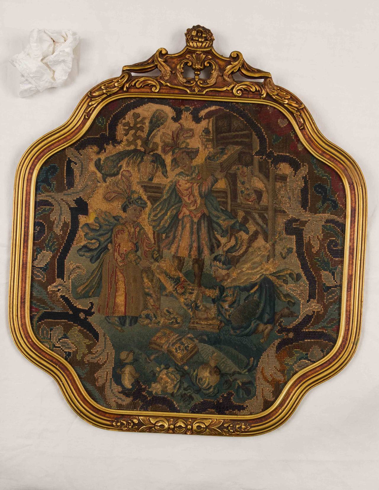 Early needlework figural tapestry, with a custom-made gold leaf frame.