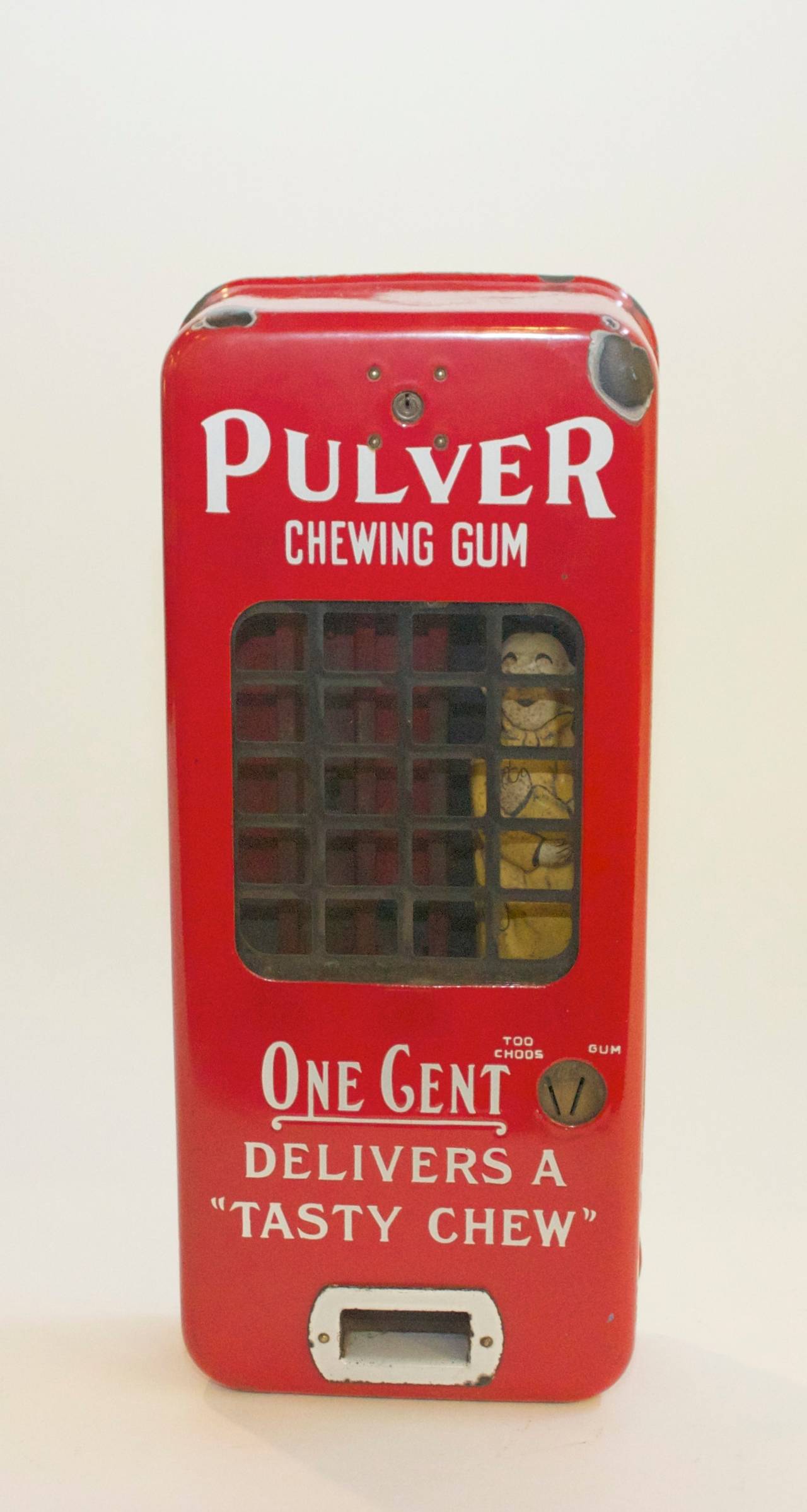 Red Pulver porcelain one cent chewing gum dispenser featuring 