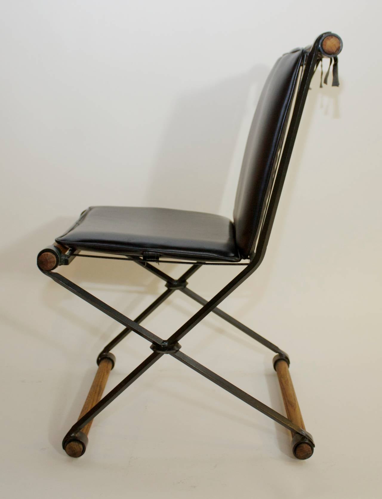 Blackened Set of Four Campaign Style Chairs by Cleo Baldon