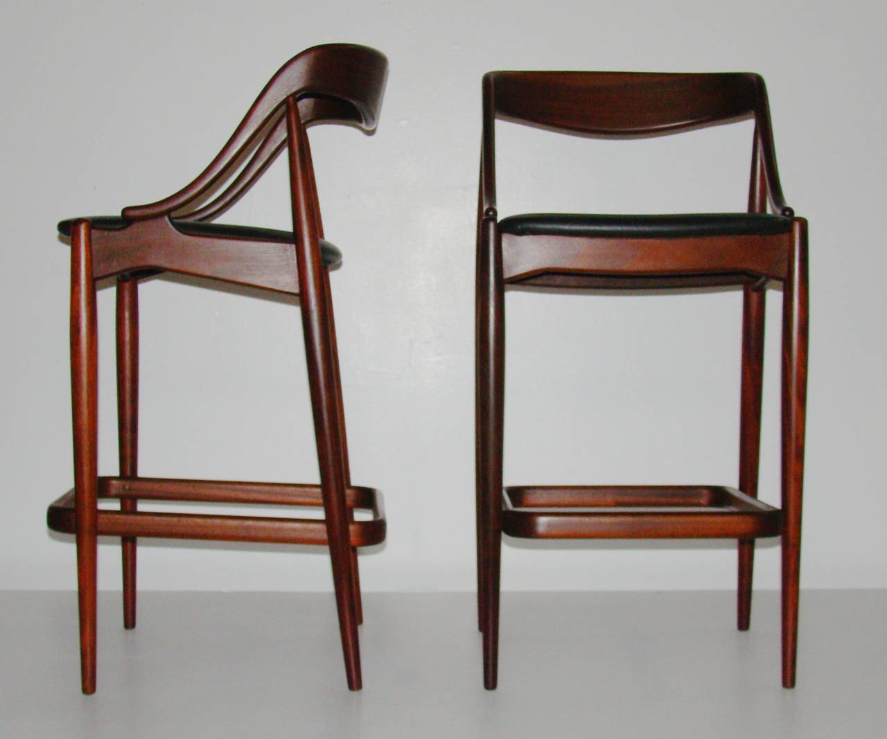 Exquisite pair of sculptural bar stools by Johannes Andersen, imported by Moreddi.