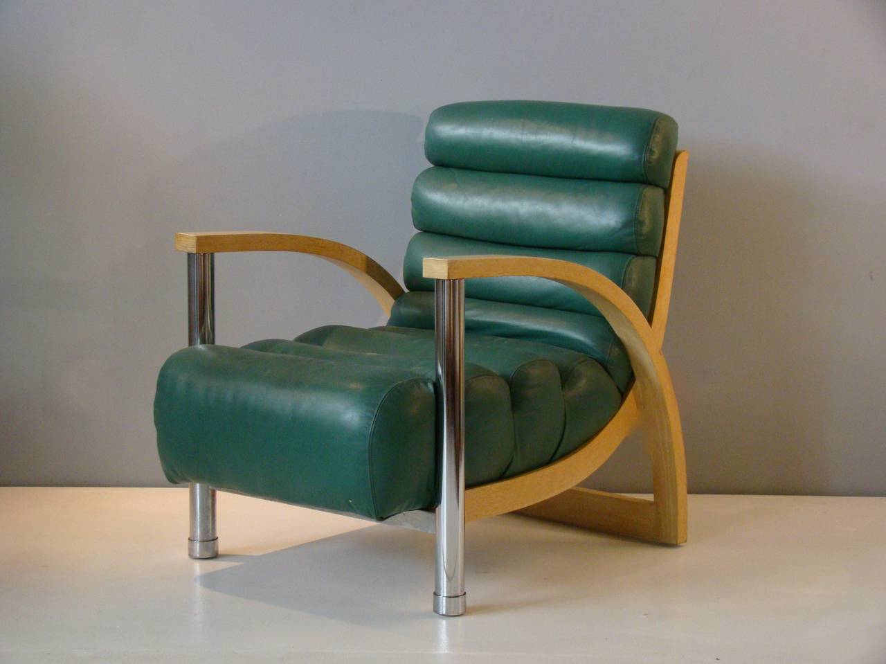Wonderful stylish and sculptural pair of Jay Spectre lounge chairs in leather, cerused oak and chrome.  Not only is this chair impressive to look at, it is also incredibly comfortable.  Will be the focal point in any room.