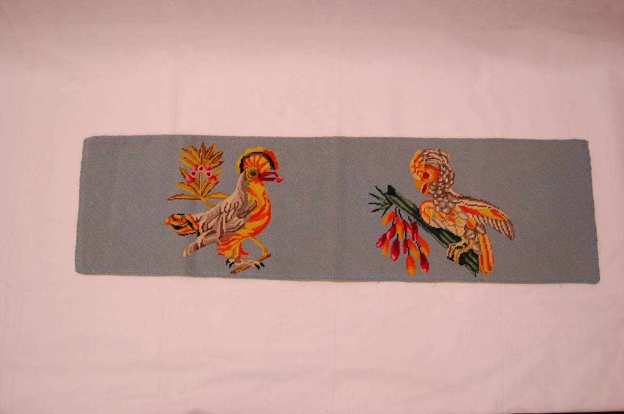 1950s wool needlepoint of two birds. Had never been unrolled from its original wrappings. These panels were originally created to be cut and made into pillow covers.There are 10 stitches per lineal inch.
