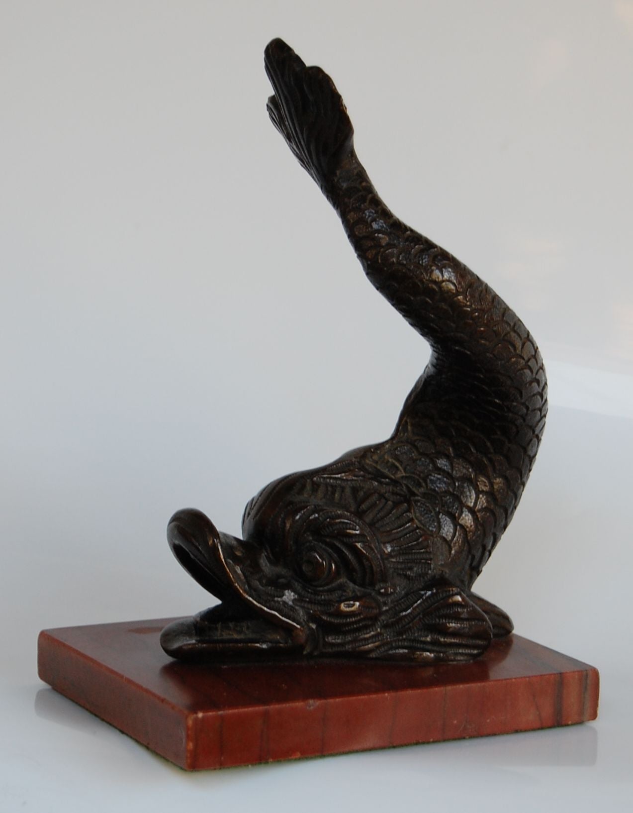 Bronze Dolphin on Red Marble Base