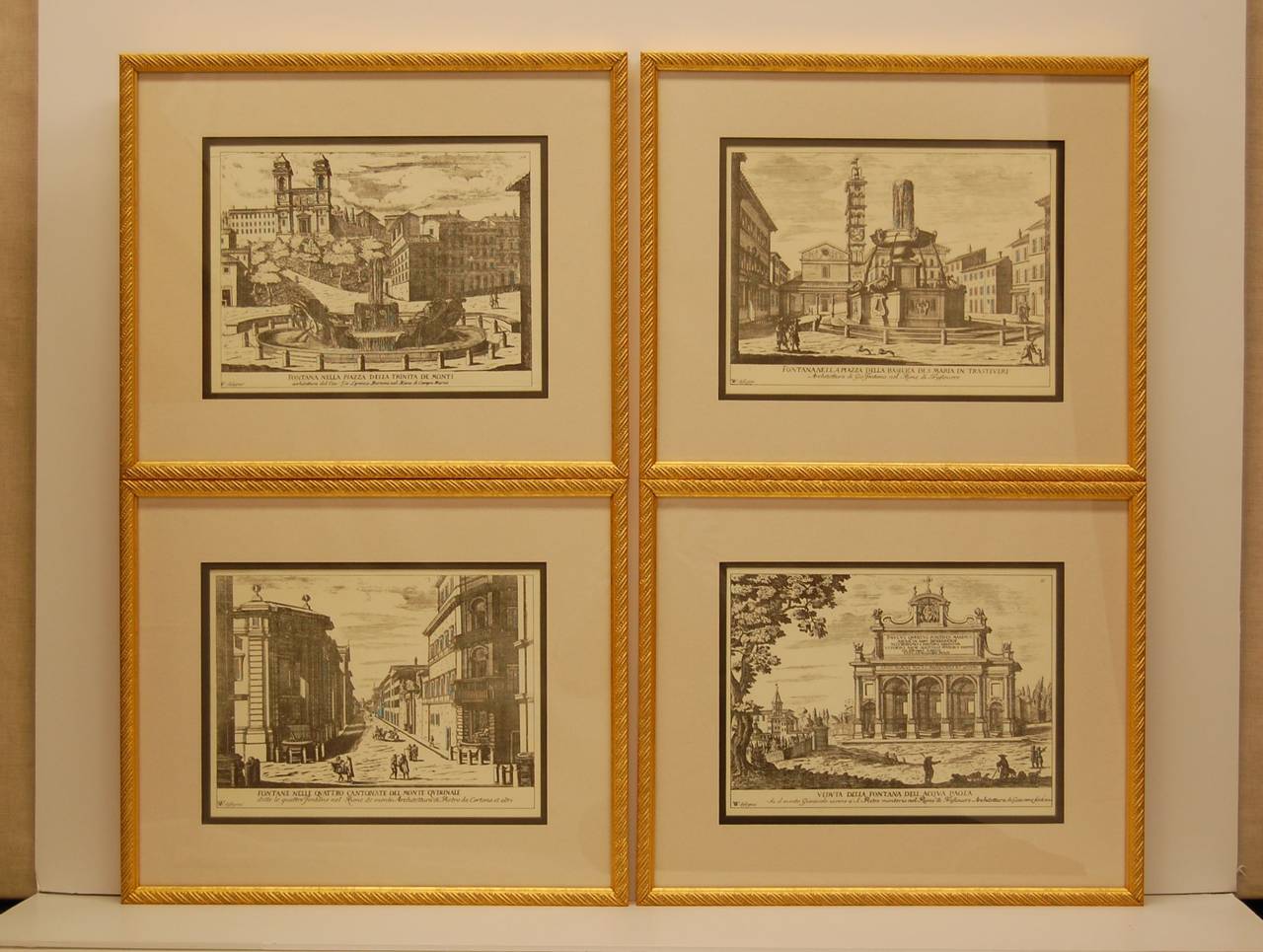 Set of four newly framed prints depicting fountains and areas of Rome. The interior mat measures 9