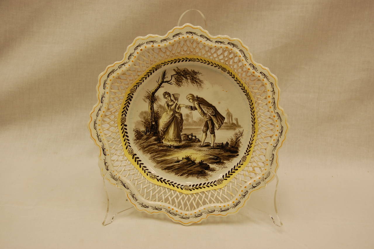 This French plate is likely a mid to late 19th century copy of an 18th century piece. What is so special about the item is the reticulated gallery, which is especially prone to damage. It is in excellent condition with the exception of the small,