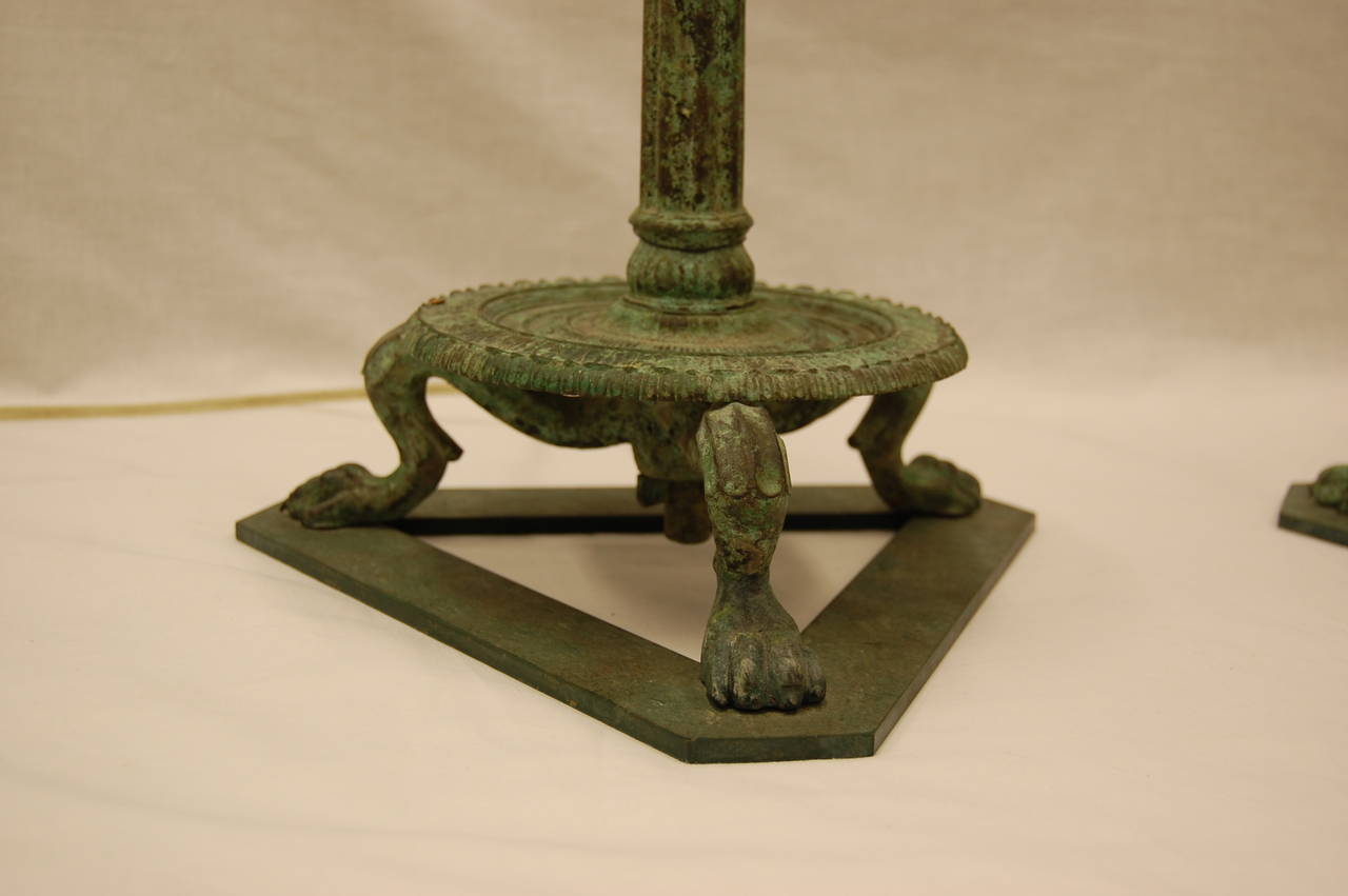 We purchased this pair of bronze candelabra as well as other pieces in the 1970s during a De-acquisition sale at the Carnegie Museum of Pittsburgh. We have since had an electrical connection added, without drilling into the actual bronze top. The