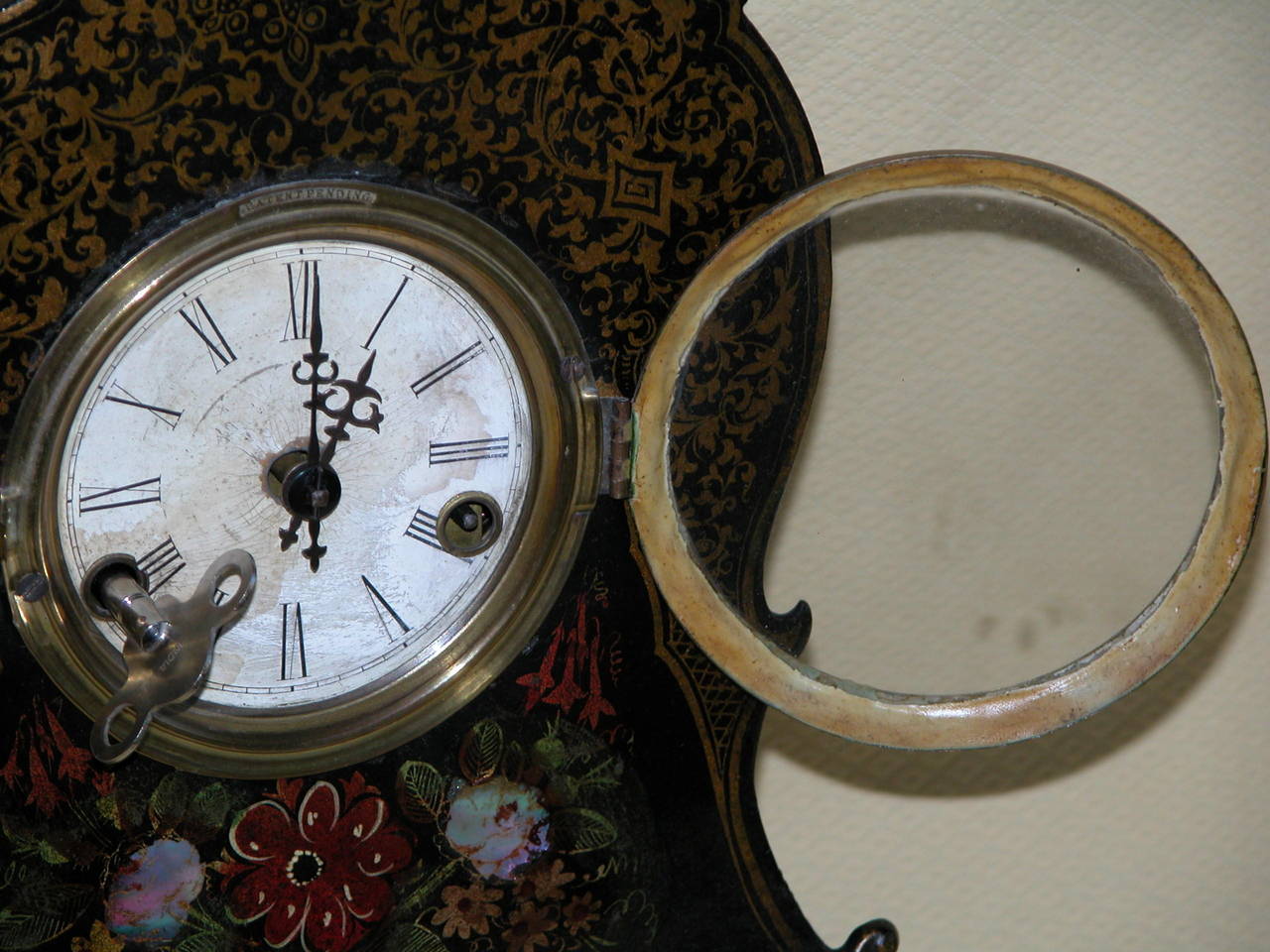 Late 19th Century Victorian Clock with Cast Iron Face, Mother-of-Pearl Inlay and Floral Decoration
