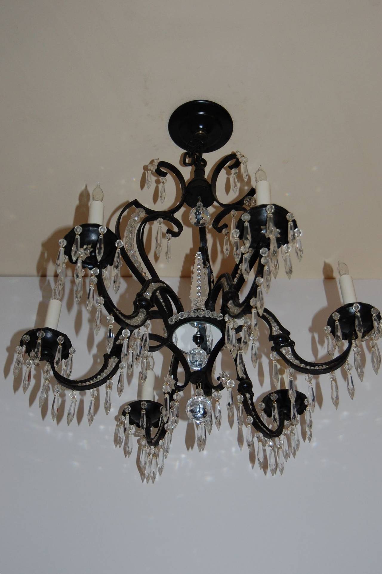Iron 6 light chandelier with crystal drops and chains of cut crystal beads in a black painted finish, recently cleaned and rewired. The length of 25" does not include app. 6" of chain.