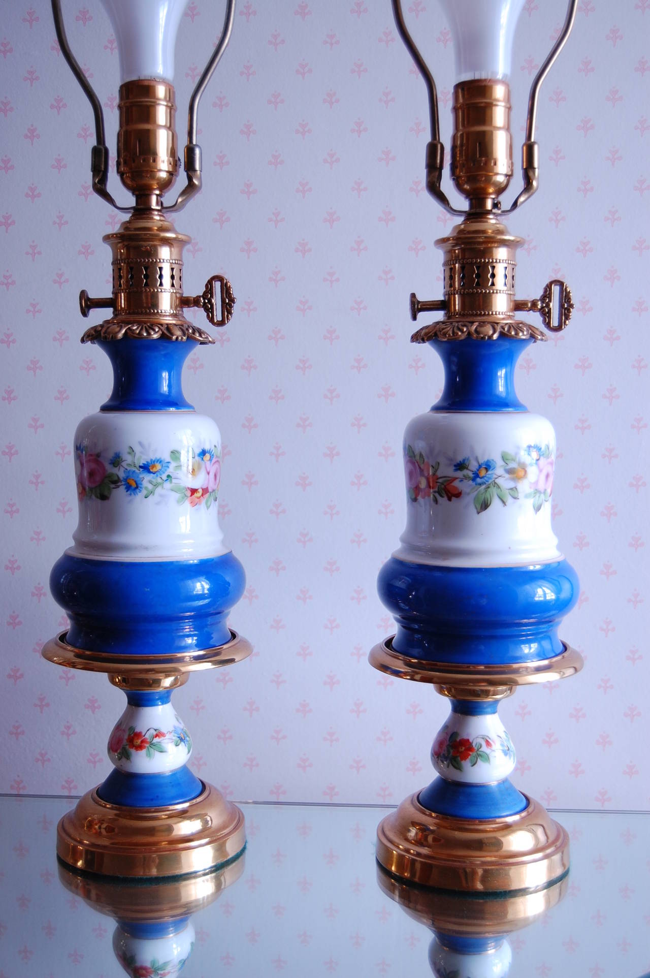 Victorian Pair of Floral Decorated French Porcelain Oil Lamps, Likely Sevres, circa 1850 For Sale