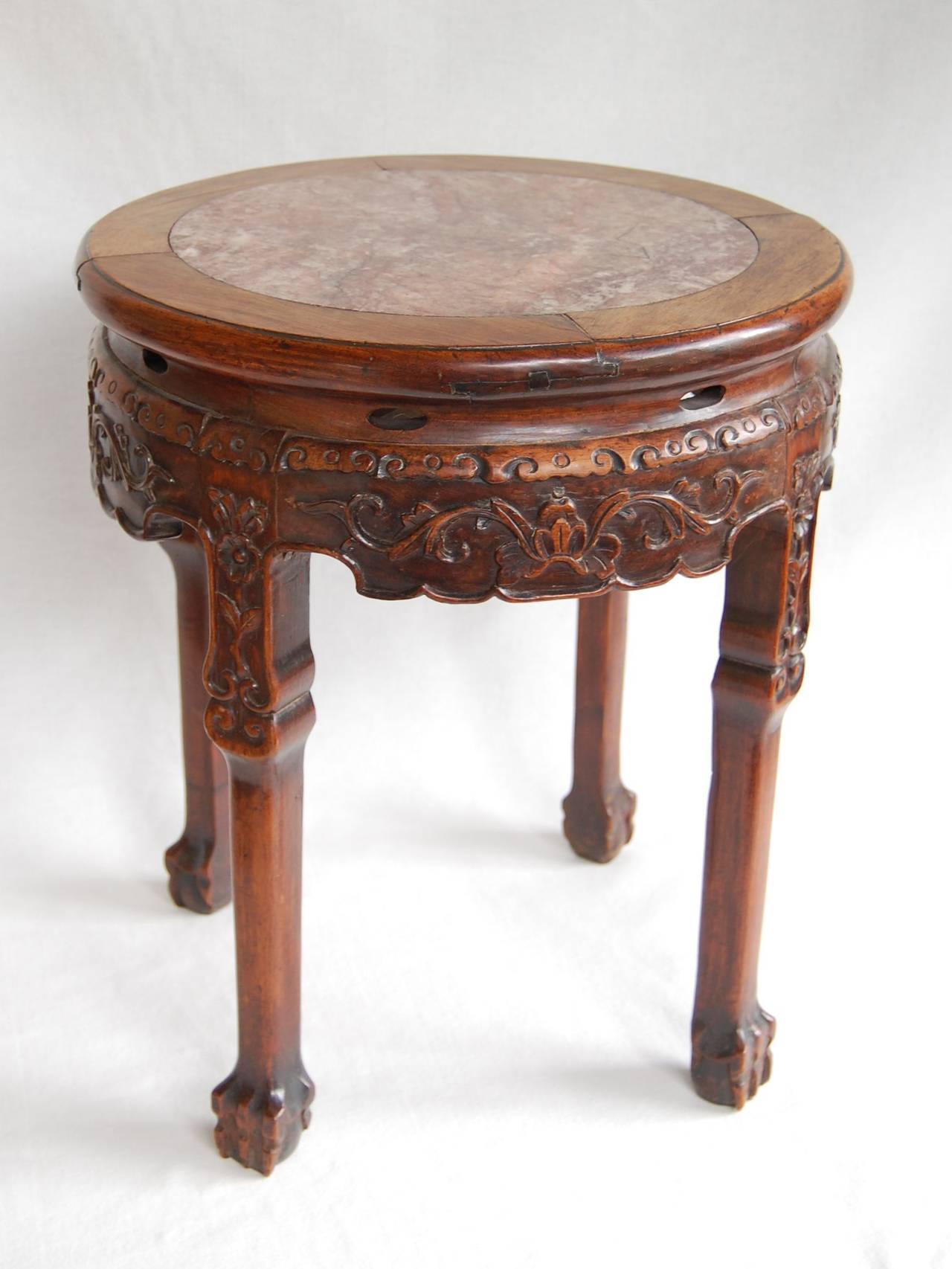 Late 19th-century circular Chinese table with marble top. Excellent condition with beautiful color and patina.