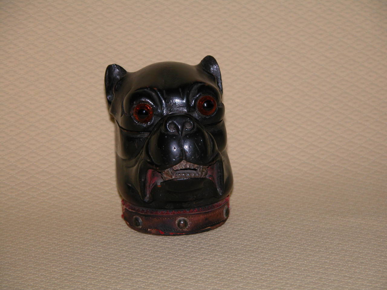 Possibly English or German, can't be sure, mid to late 19th century. Condition is excellent with minor loss of leather around the dogs collar. Hinges are tight, original inkwell still inside. The grimacing face with teeth showing seems to be