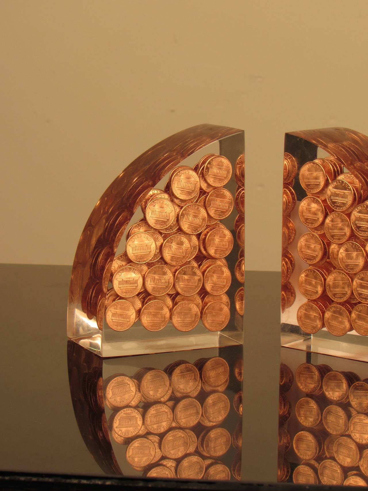 Gleaming Lucite Demi-lune Bookends with Suspended Pennies In Excellent Condition In New York, NY