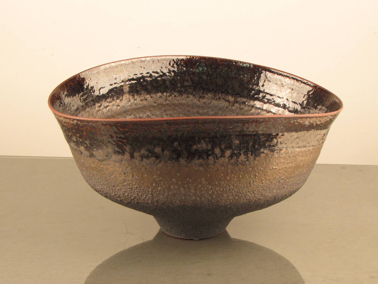 Jaw-dropping footed bowl with metallic black glaze by working studio potter, Jeremy Briddell (b.1971). Incredibly well-thrown and beautifully balanced; Briddell is a potter who excels at both skillful wheel work and a keen eye for color and form.