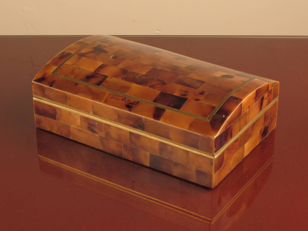 Handsome tesselated tortoise shell dresser box with brass inlay made by Maitland Smith.