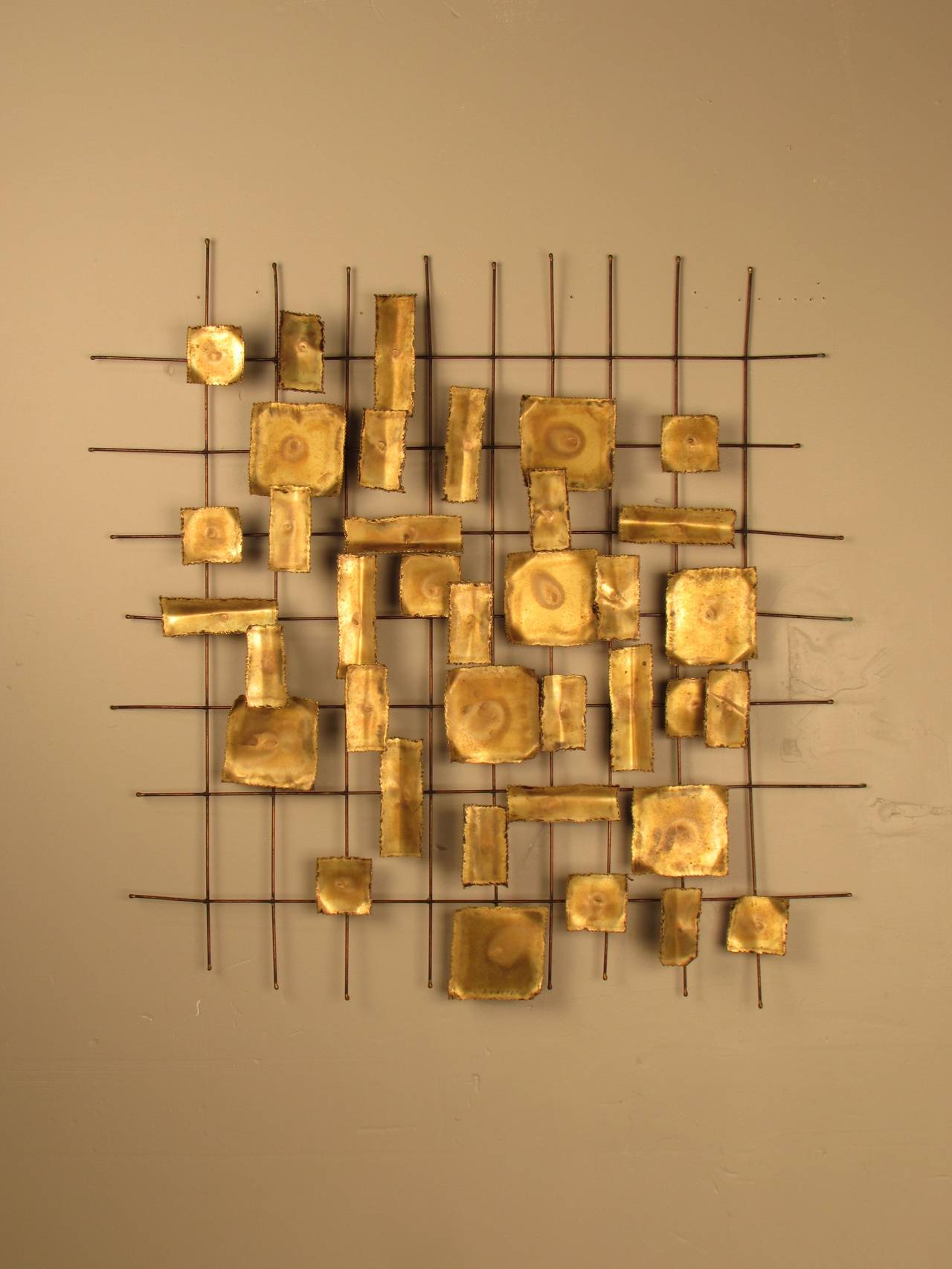 Delicate Torch Cut and Welded Brutalist Wall Sculpture. Constructed of layered brass panels mounted to a brass wire frame.