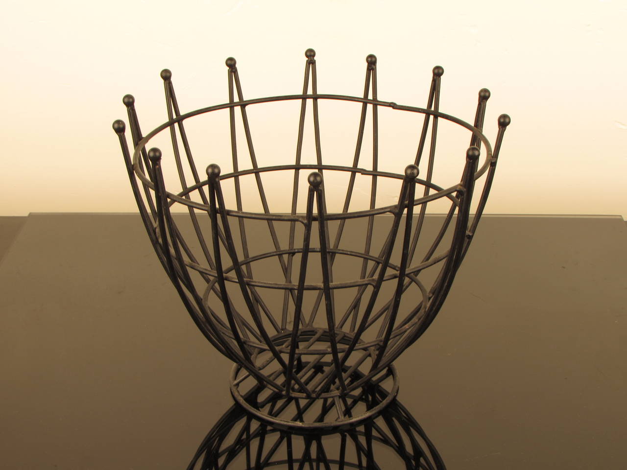 Stunning large sculptural midcentury Austrian wrought iron wire fruit basket. Heavy and substantial--a wonderful piece of functional sculpture with a fantastic look.