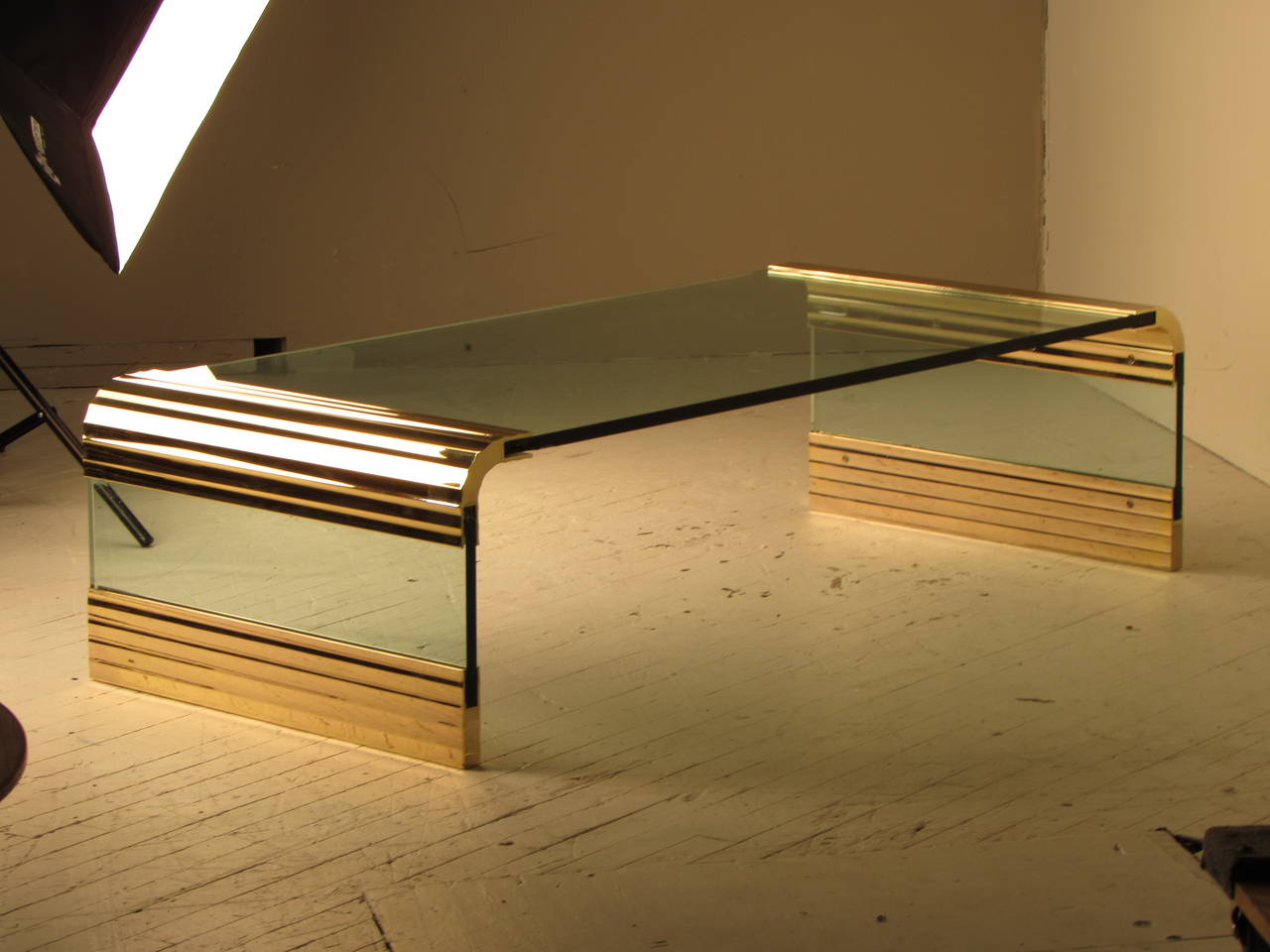 Large, impressive cocktail table designed by Leon Rosen for Pace Collection. Stunning brass waterfall edges with scalloped detail accompanying the signature Pace Collection 3/4