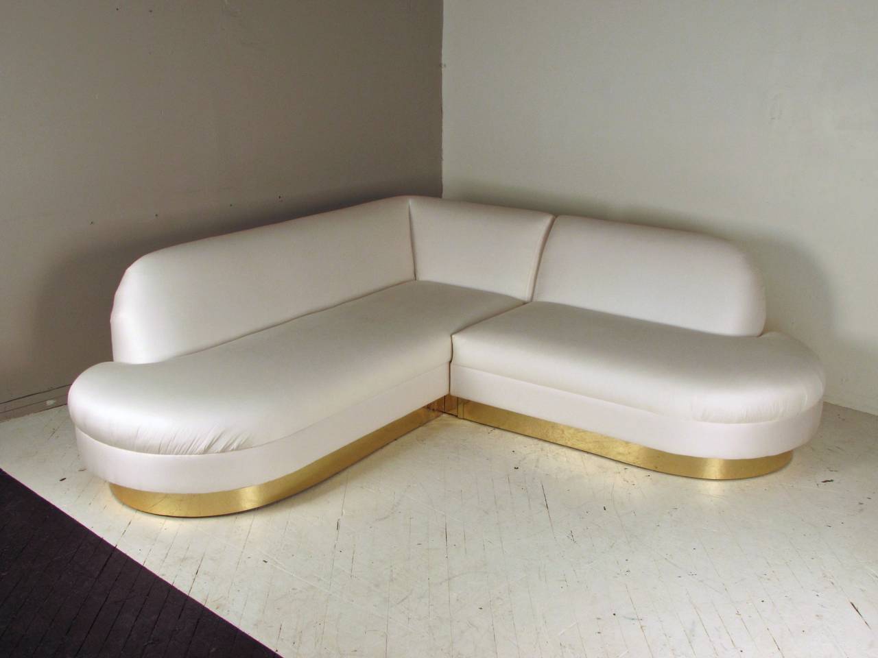 A rare and glamorous two-piece sofa by Adrian Pearsall for Comfort Designs, Inc. reminiscent of the work of Vladimir Kagan, Milo Baughman and Karl Springer. This is a very unusual shape for Adrian Pearsall who is widely known for his Gondola sofas