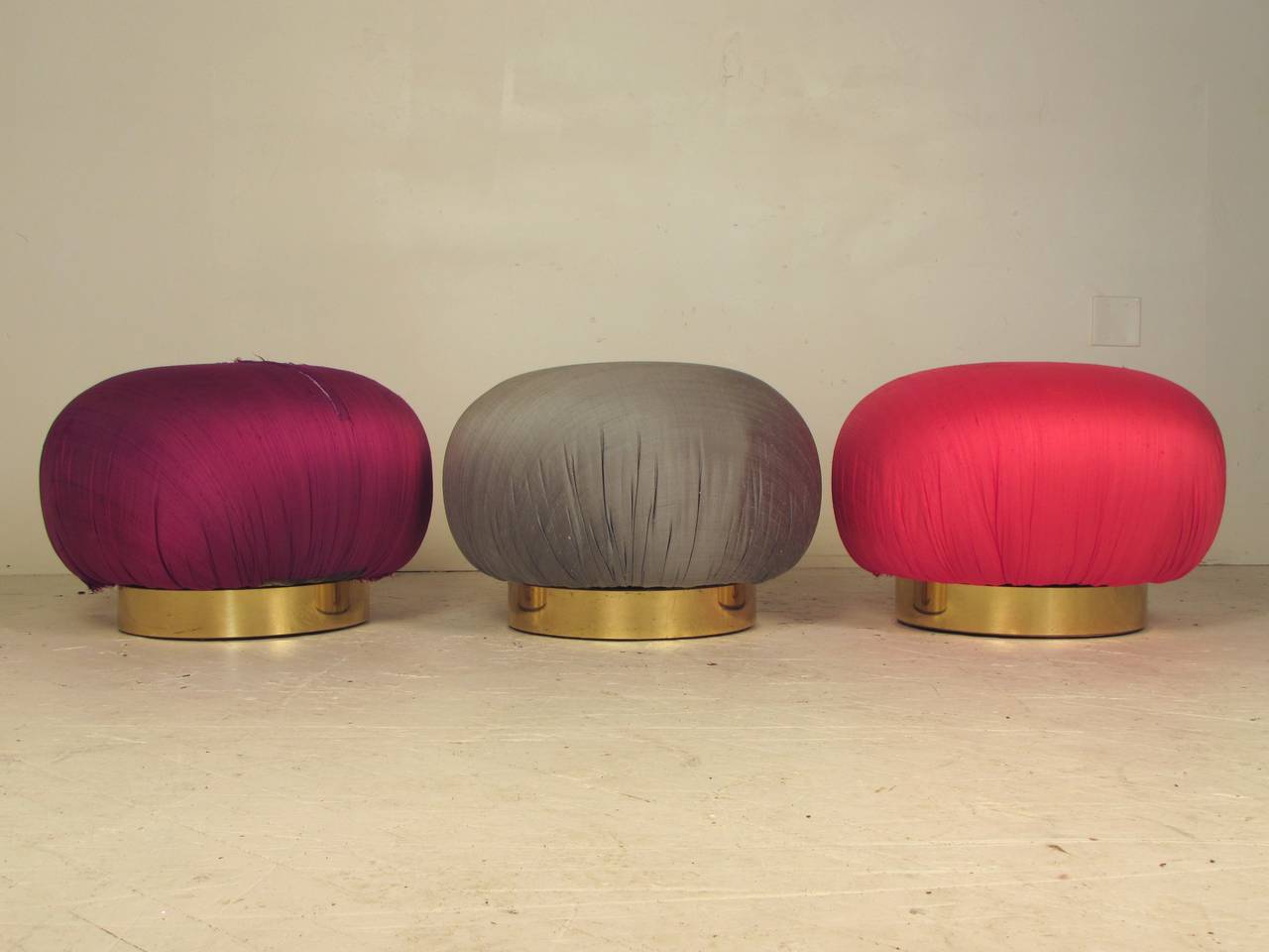 A rare trio of poufs or stools or ottomans by Adrian Pearsall for Comfort Designs, Inc. reminiscent of the work of Karl Springer and Vladimir Kagan. Comfort Designs, Inc. is the company that Mr. Pearsall founded after selling Craft and Associates to