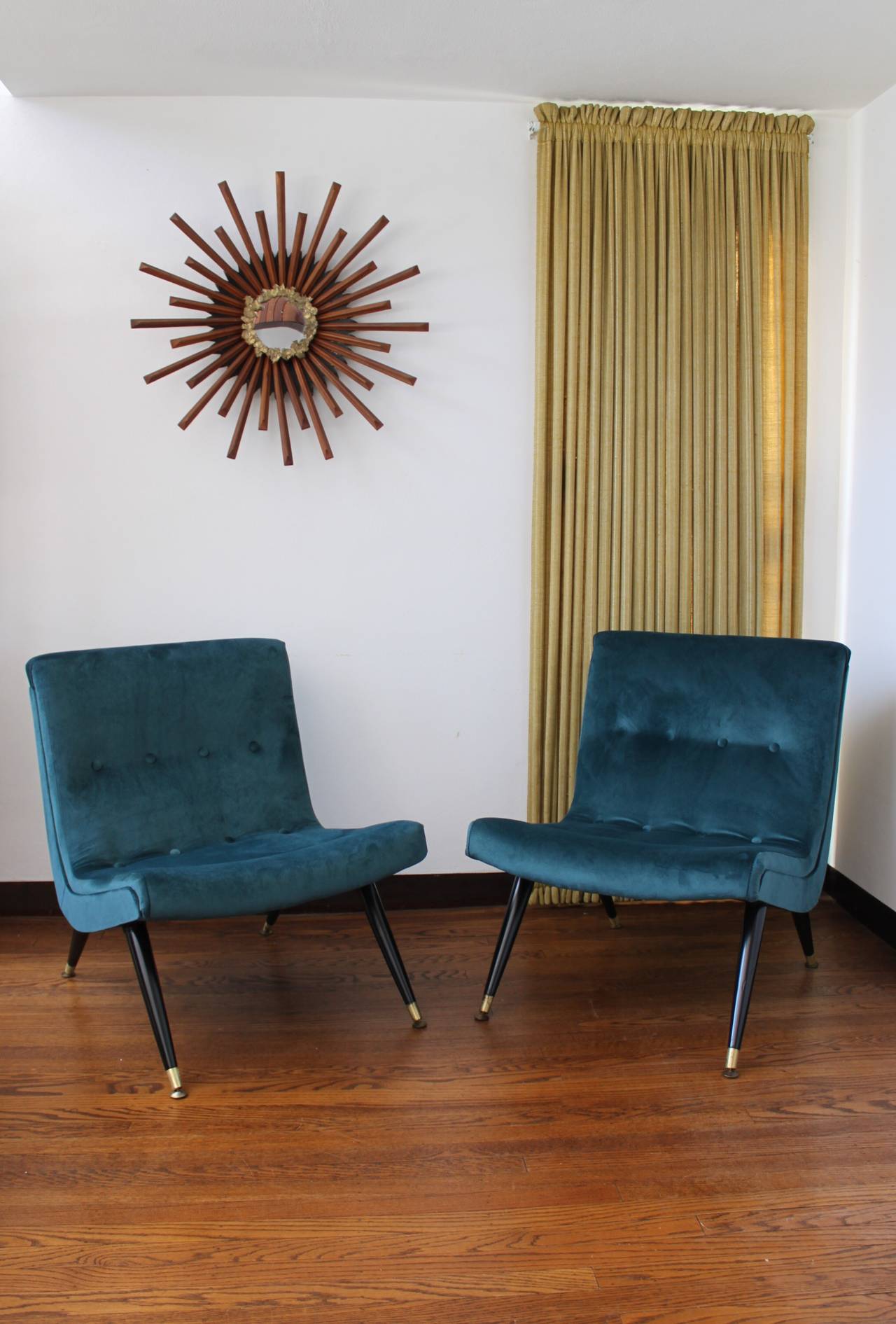 Exquisite scoop lounge chairs in a new buttery peacock velvet by Milo Baughman. Legs are lacquered walnut with brass feet. Fantastic scale and quality.