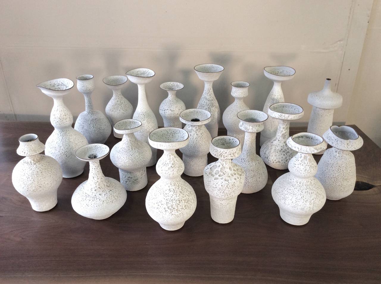 Handmade studio pottery vases in a white crater glaze by working studio potter, Jeremy Briddell (b.1971). Pieces shown here range from 10