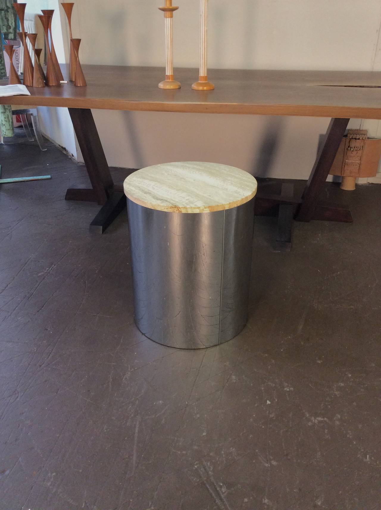 Sleek chrome drum table with travertine top by C. Jere, circa 1975. This piece is in excellent vintage condition. Chrome has very few signs or wear. Travertine top has no chips or losses.