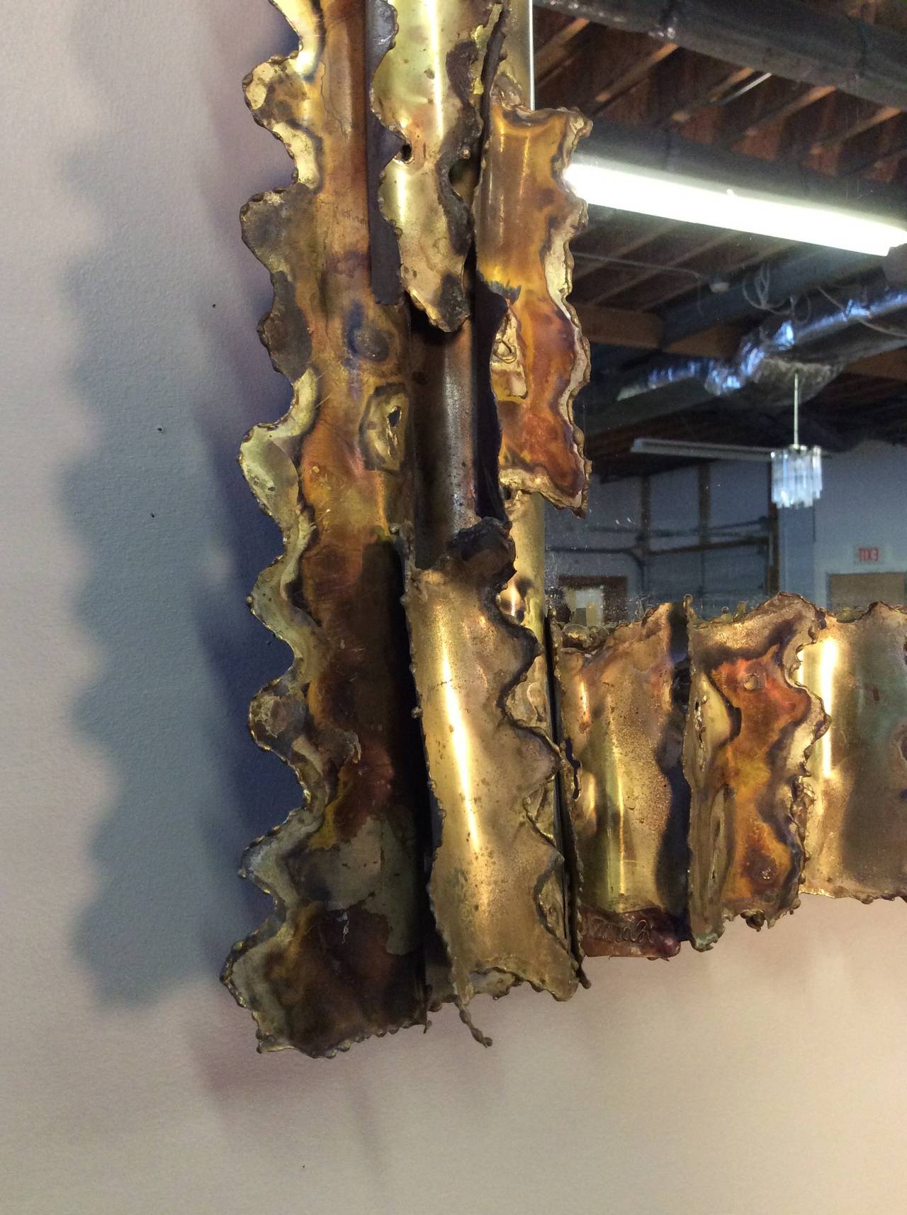 Sculptural Brutalist torch cut and welded brass mirror, circa 1975. Condition is excellent. 

In the style of Silas Seandel, Paul Evans, Tom Greene, C. Jere, etc.