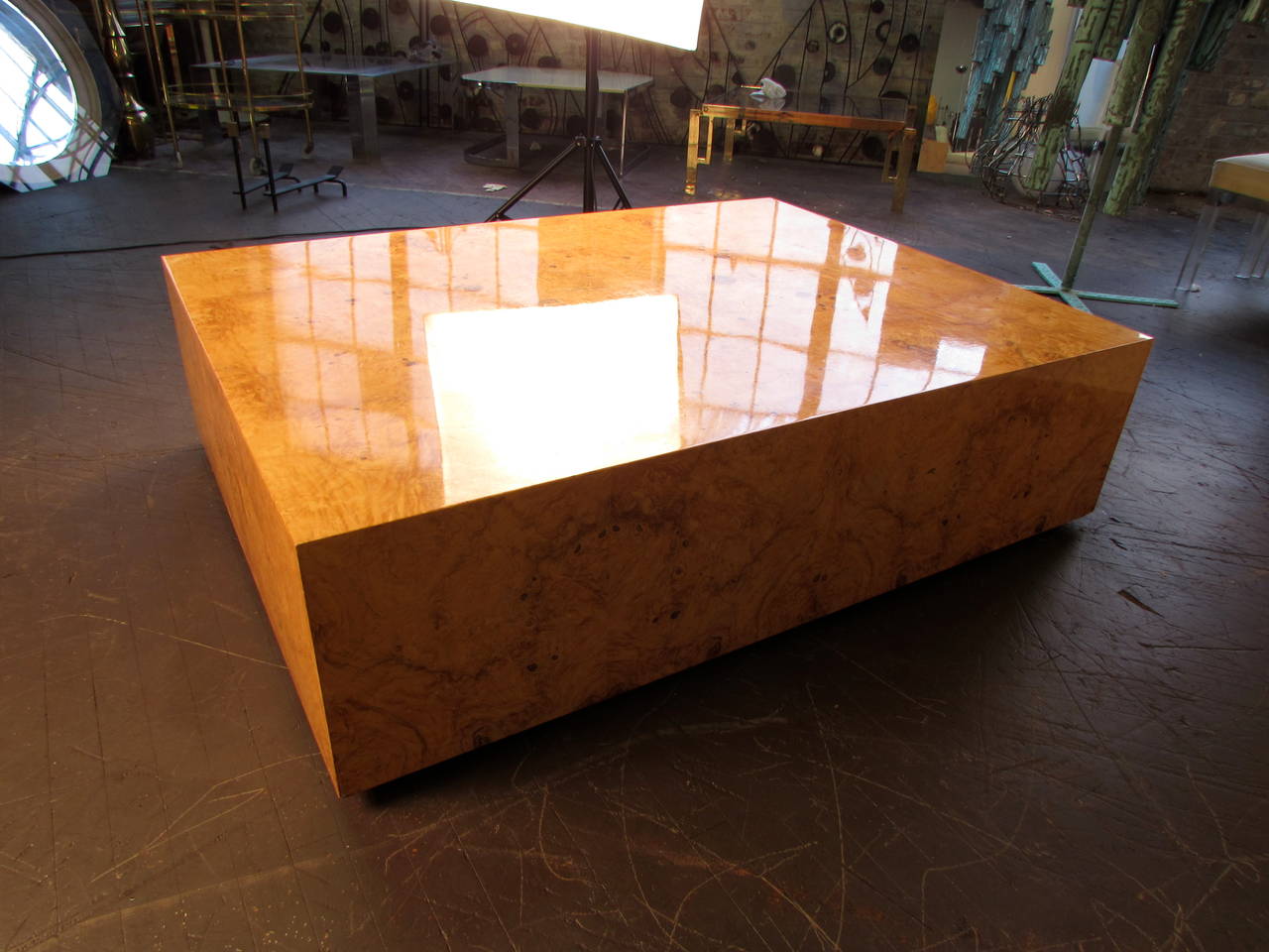 Enormous Burled Wood Coffee Table by Milo Baughman for Thayer Coggin, circa 1970. When not in use as a coffee table, it can double as a dance floor or landing pad. It's that big. It has a high gloss lacquer finish that is most visible in the second