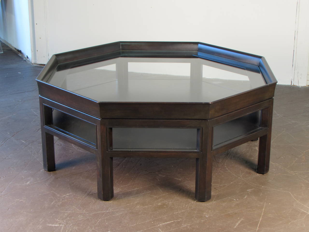 Simple elegant octagonal coffee table by Baker Furniture. Finish is a dark espresso color. Condition is excellent.

We offer free delivery to NYC and Philadelphia area. Delivery to DC, MD, CT, and MA are available if schedule permits please