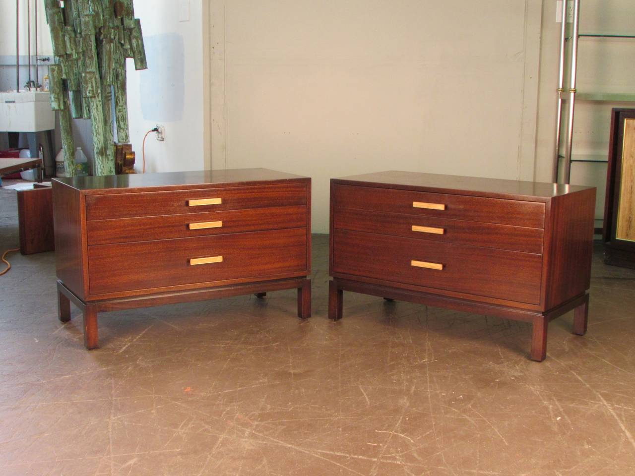 Rare ribbon mahogany end tables or nightstands by Harvey Probber Studio, circa 1965. The handles are brass with a bleached rosewood detail. These chests were custom ordered by and built for the original owner. Used as large bed-side tables or