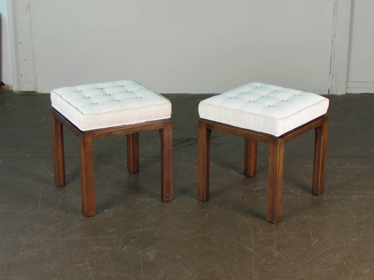 Stately pair of signed upholstered stools or benches by Harvey Probber, 1965. These stools have been refinished and reupholster in a texted cream velvet. Condition is immaculate.

We offer free regular deliveries to NYC and Philadelphia area.