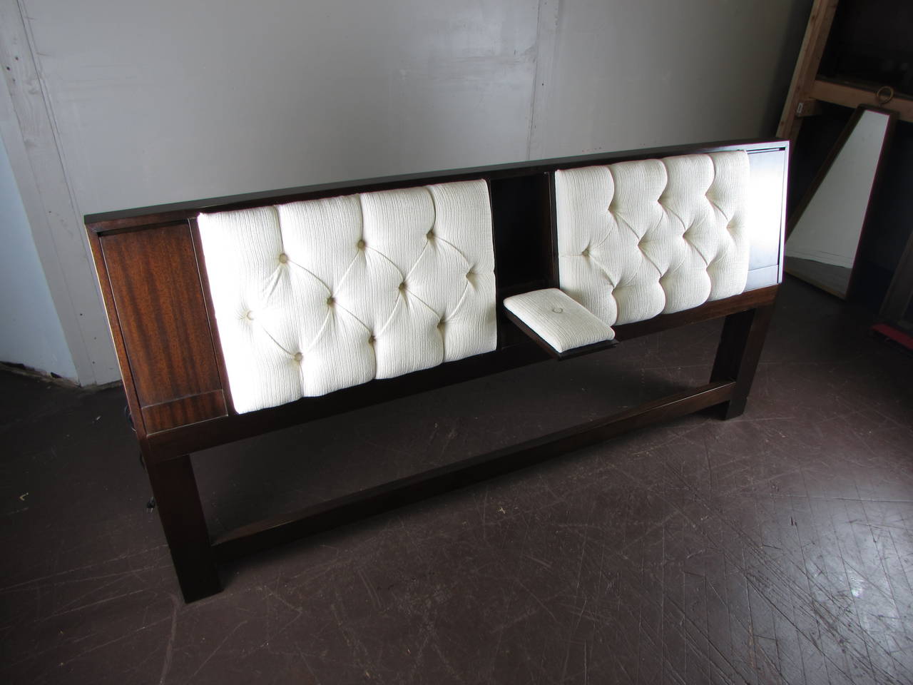 Dark mahogany headboard with reading lights and armrest by Harvey Probber, 1965. Telescopic reading lights and armrest are hidden in panels that fold up for storage.

See this item in our private NYC showroom! Refine Limited is located in the heart