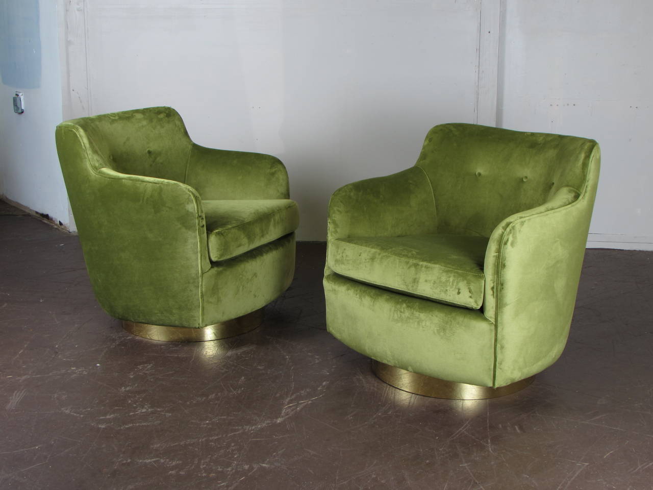 Extraordinary highback swivel chairs in velvet and bronze by Milo Baughman for Thayer Coggin, circa 1970. These chairs have been upholstered in a dark chartreuse / olive velvet. The bases have been restored in a custom bronze metal. These chairs