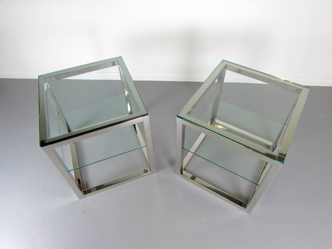 Late 20th Century Minimalist Chrome Cube Tables with Glass Shelves in the Style of Milo Baughman