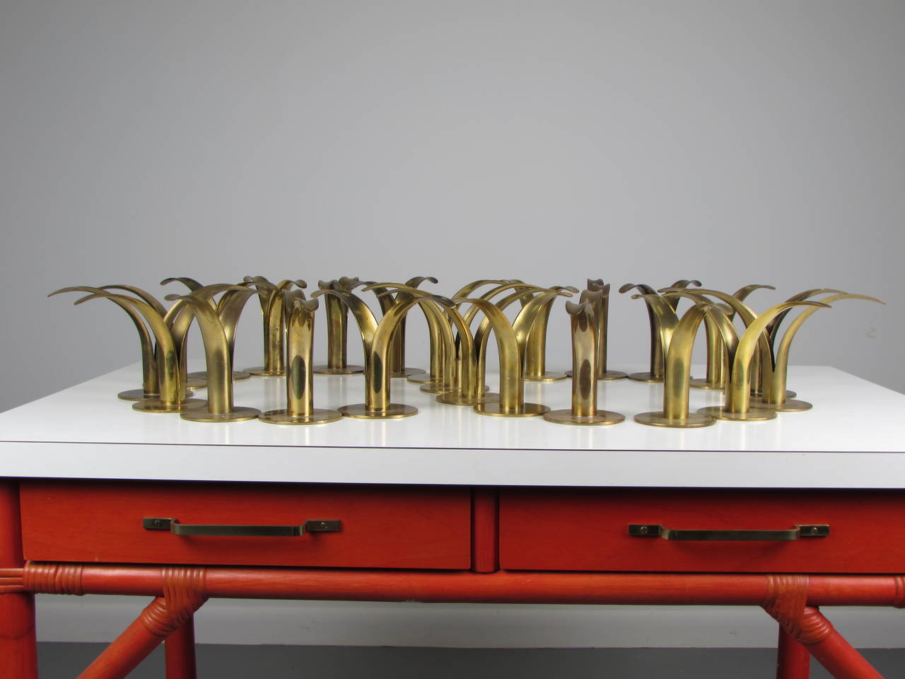 Awesome collection of brass lily candleholders by designed by Ivar Ålenius Björk for Ystad Metal in 1939. Produced through the 1950s. Collection of 23 pieces in various condition. Some have a slight size variation.