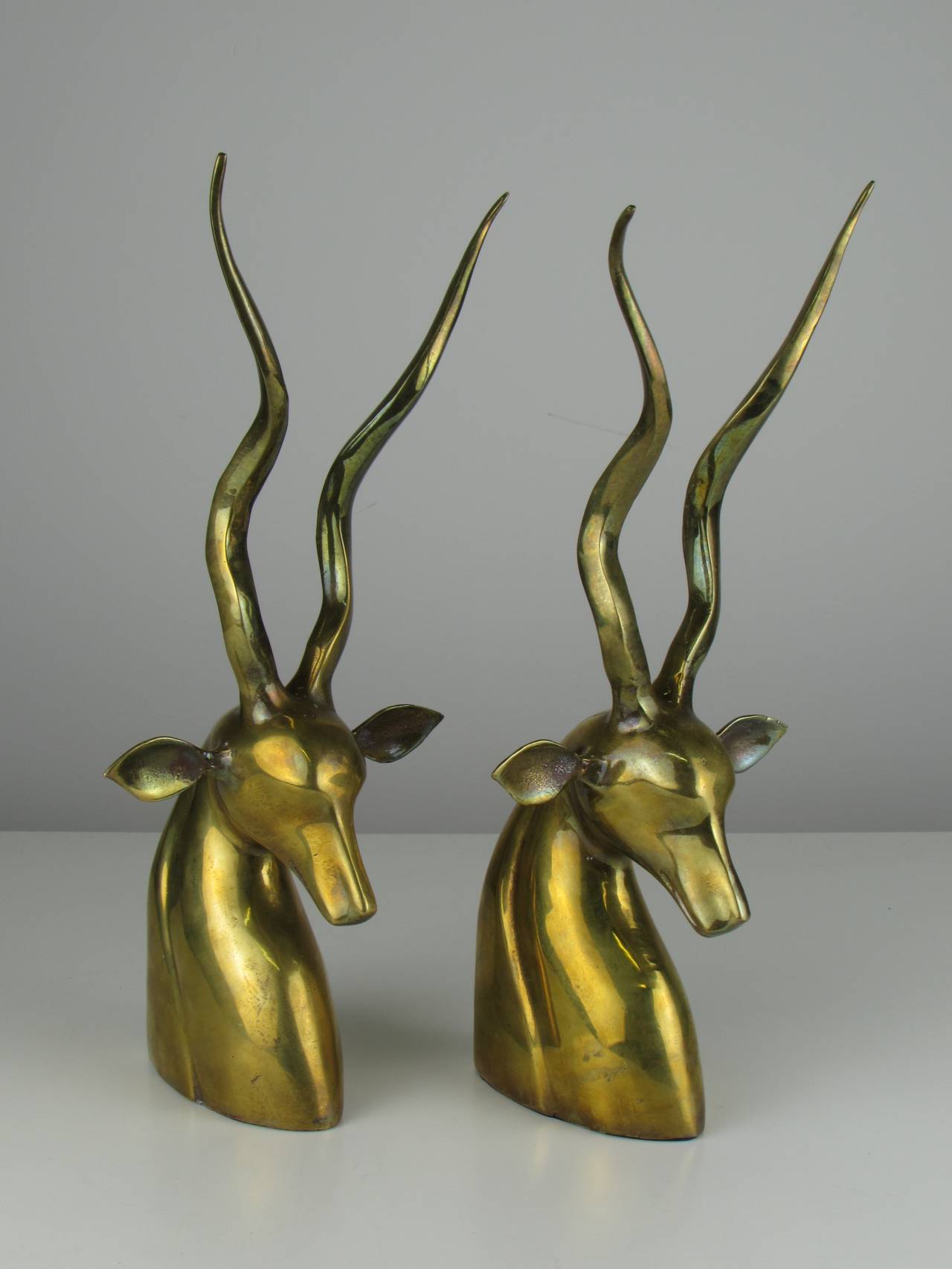 Fabulous large brass African kudu bookends in the style of Karl Springer, circa 1970. Beautiful tones of patina throughout. Overall excellent condition.