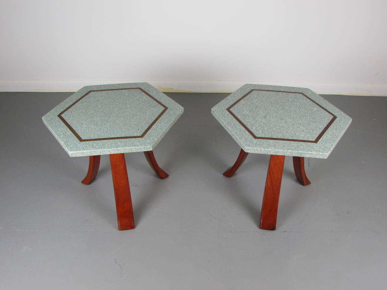 Pair of sculptural end or side tables with terrazzo and brass inlaid tops by Harvey Probber, 1960s. Absolutely remarkable design that fits into any room. The unusual sea foam hued terrazzo tops are flawless and stunning. Walnut bases are very sturdy