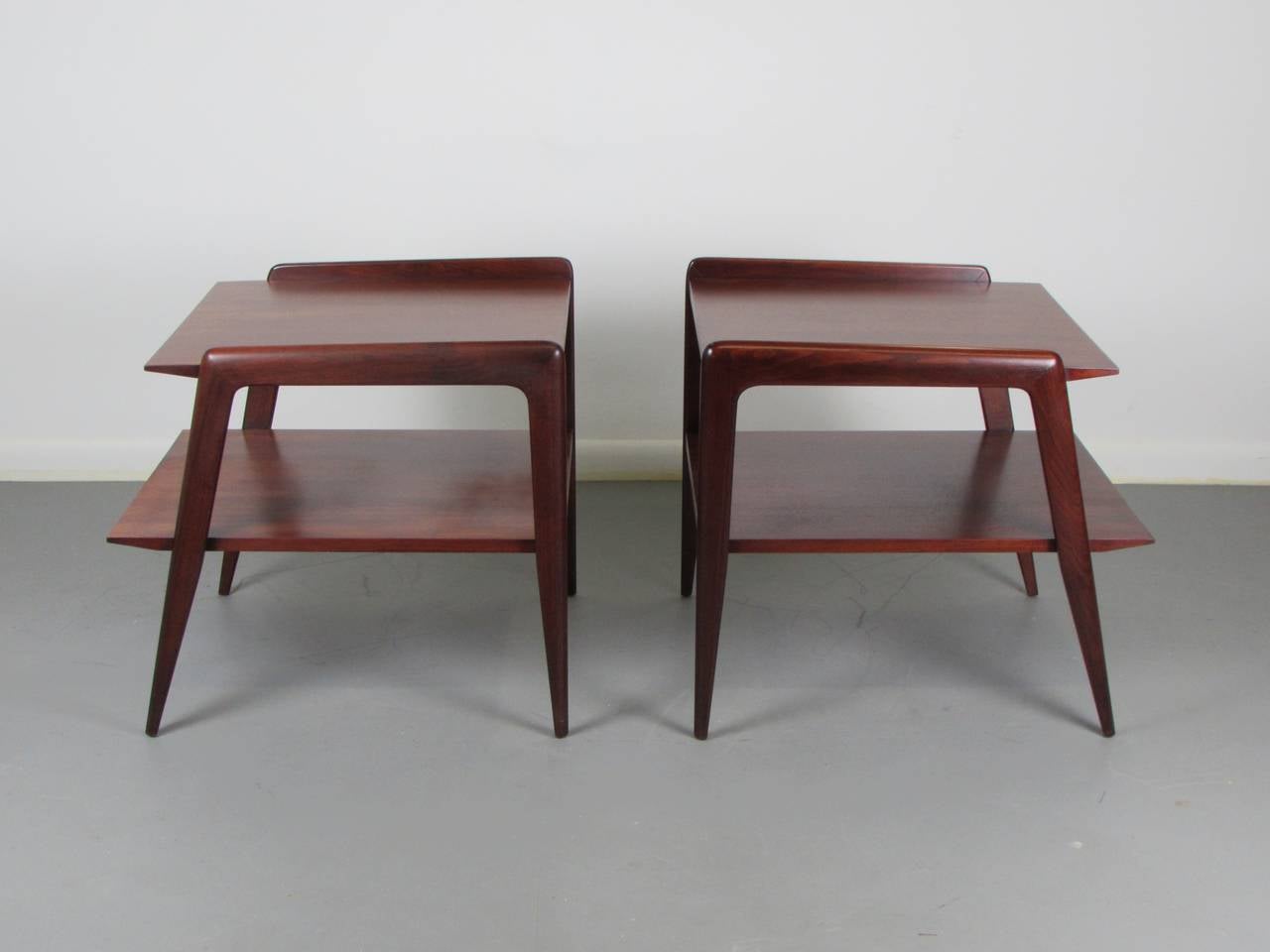 Rare and wicked pair of end tables by M. Singer & Sons, c1950. Attributed to Gio Ponti. Superb quality in solid mahogany. Incredible design and detail. Legendary Italian designers such as Carlo Di Carli, Gio Ponti, and Ico Parisi designed for Singer