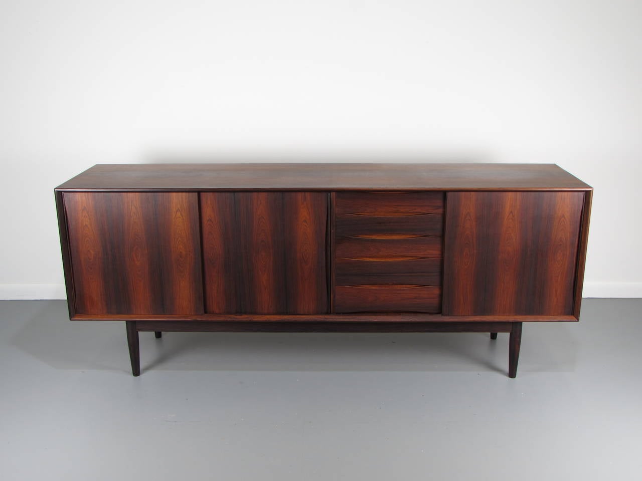 Exceptional Danish modern rosewood buffet with sliding doors, 1960s.

See this item in our private NYC showroom! Refine Limited is located in the heart of Chelsea at the history Starrett-LeHigh Building, 601 West 26th Street, Suite M258. Please