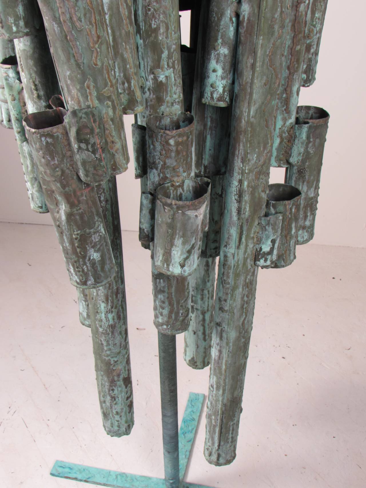 Truly monumental piece of sculpture and an exceptional, wicked example of the Brutalist style. Piece is made of torch cut tubular copper with heavy verdigris patina, welded together with silicone bronze. The piece also features applied decoration of