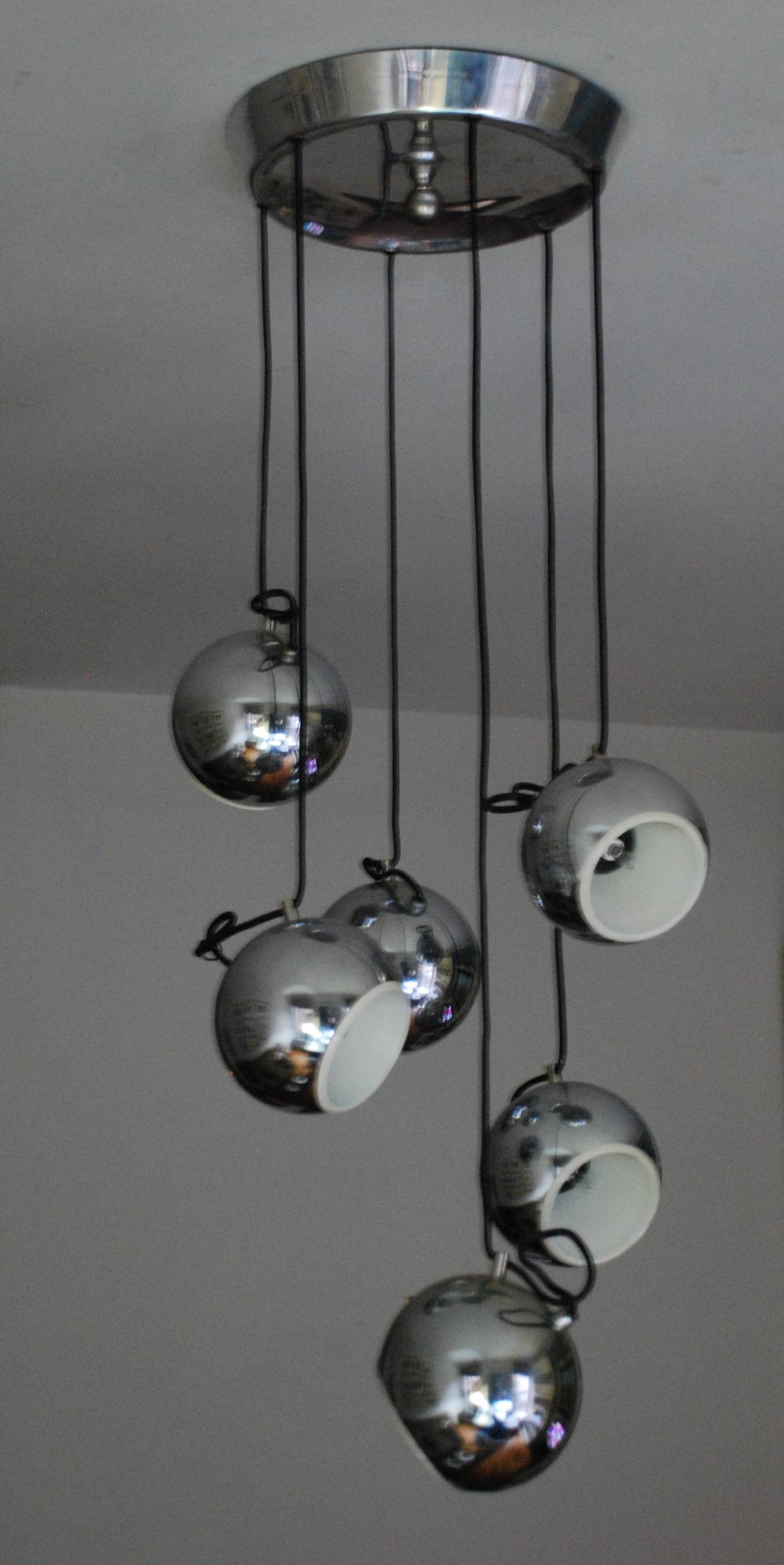 Mid-century six globe chrome pendant.  Italian chrome six-light pendant with adjustable cords. Newly re-wired with candelabra bulb sockets.  Italy, circa 1960 
Overall dimension 36