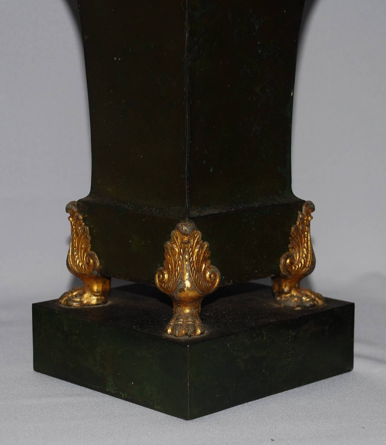 Pair French Empire dark green tole jardinieres with gilt metal paw feet on raised platform with original liners. 
Dimension: 7.75
