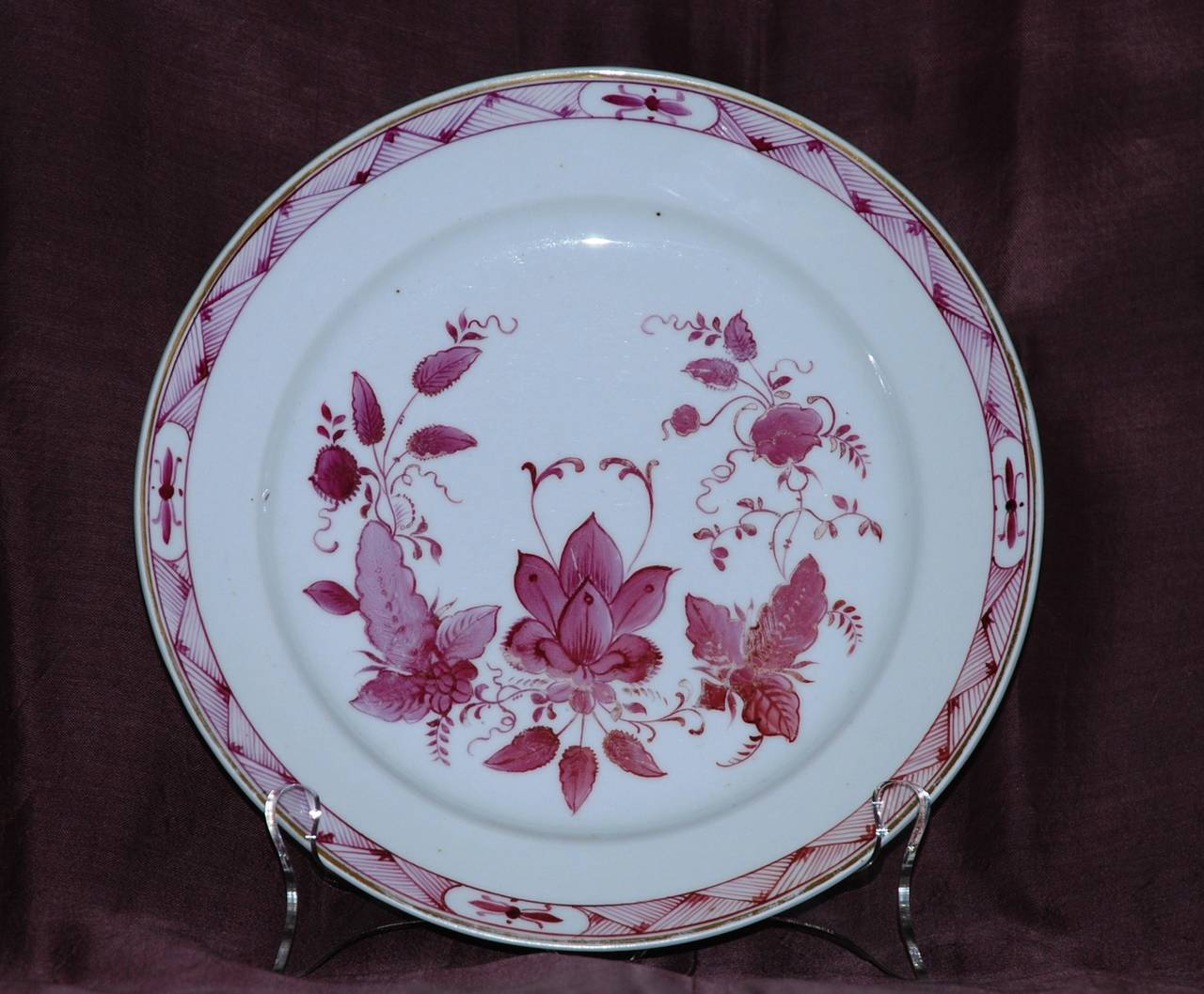 Pink, white and gilt Russian floral porcelain plate. Russian porcelain plate of pink/magenta and white indianische floral design with basket weave border and gilt rim. Moscow. Fabrica Gospodina Gulina, circa 1830-1850. Marking: Signed 