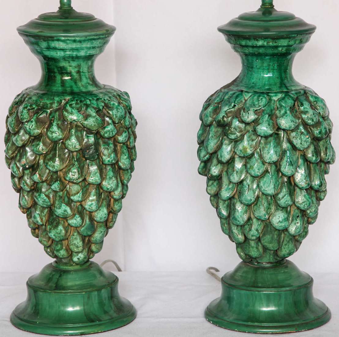 Pair of vintage Italian rich green Majolica pine cone lamps with painted metal fittings. Measures: Overall 30