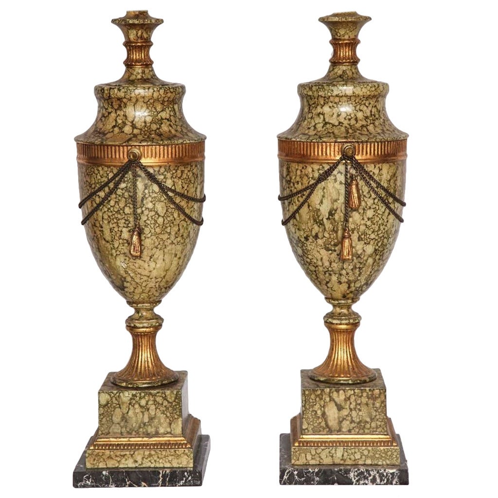 Pair of large marbleized green tole urn-form lamps on raised pedestal with black marble base; metal chains and tassels. Newly electrified with black silk cord. 
Dimension: 6