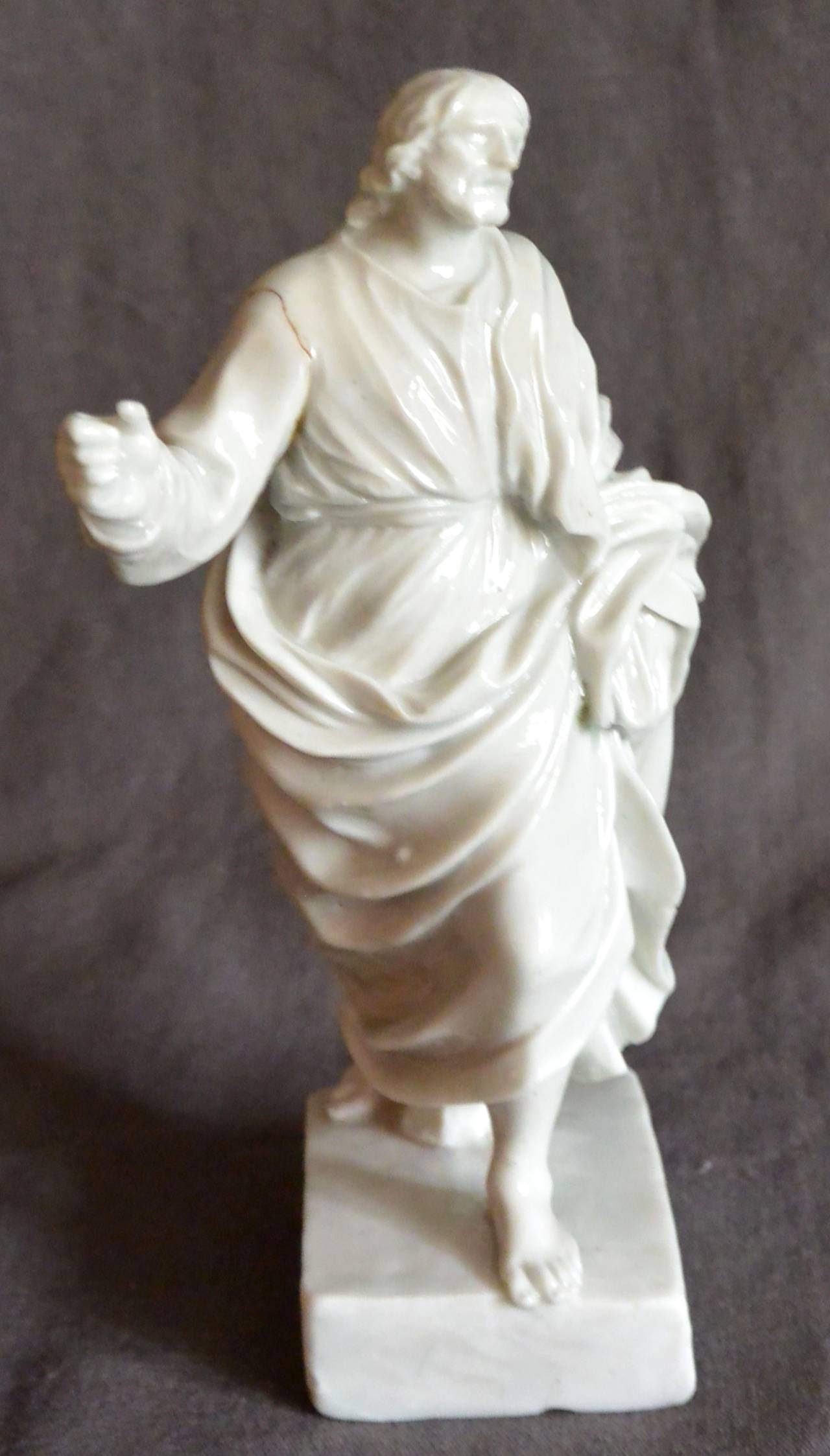 St. John the Revelator white porcelain sculpture. An early white Doccia porcelain figure of St. John the Revelator on the isle of Patmos. “‘And He said unto me, ‘It is done. I am Alpha and Omega, the beginning and the end. I will give unto him that