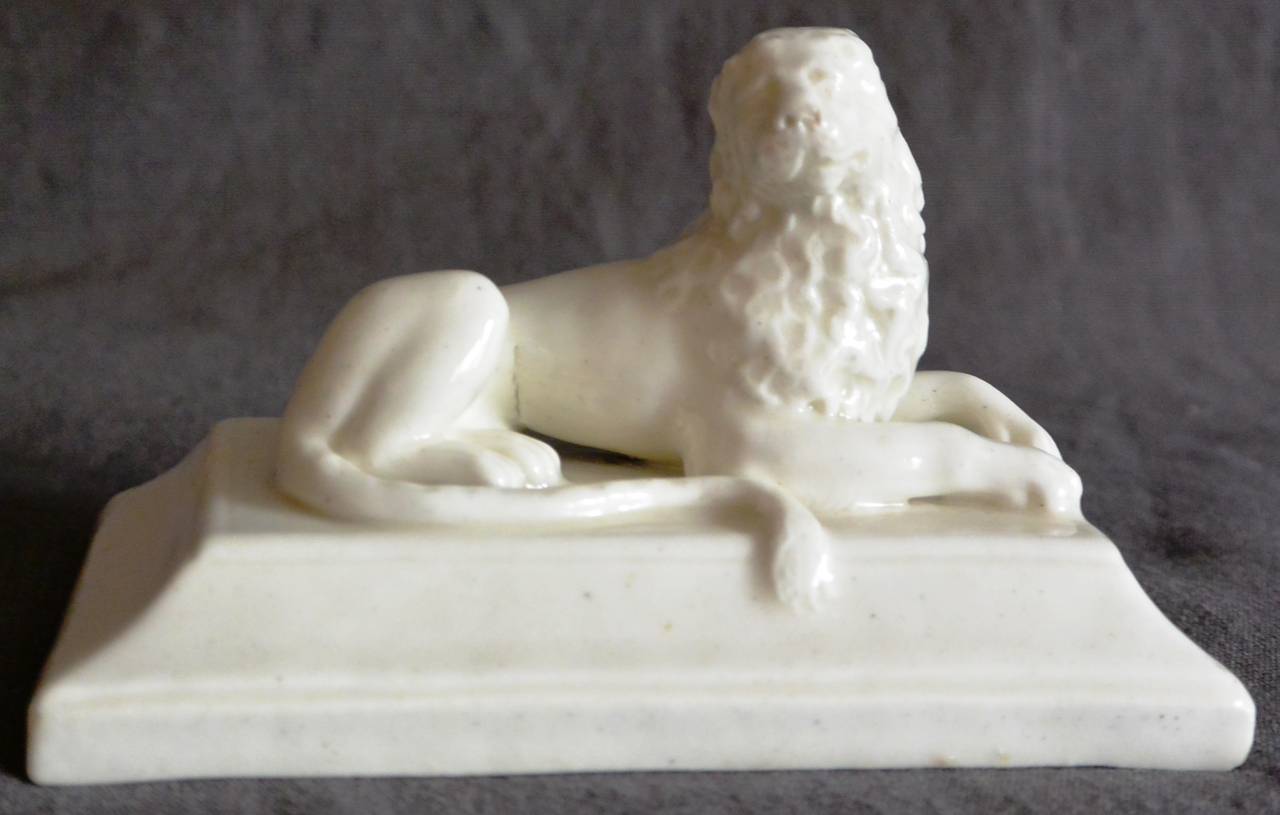 Vinovo white soft-paste figure of a recumbent lion on a canted rectangular plinth, Italy, circa 1780. Incised cross and V mark. See similar example in the collection of Palazzo Madama, Turin.
Dimension: 4.88