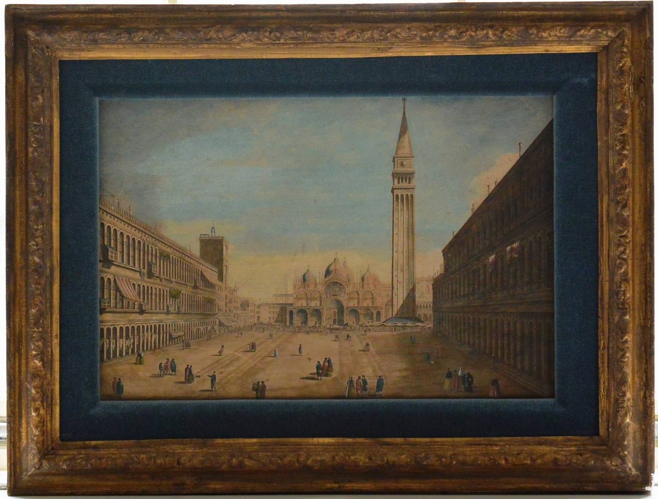 Pair of hand-colored Venetian engravings after Canaletto, 18th century hand-colored Venetian engravings in period gilt frames after Canaletto (1697-1768) with view of the Grand Canal towards the Custom Point from Campo San Vio and Piazza St. Marco