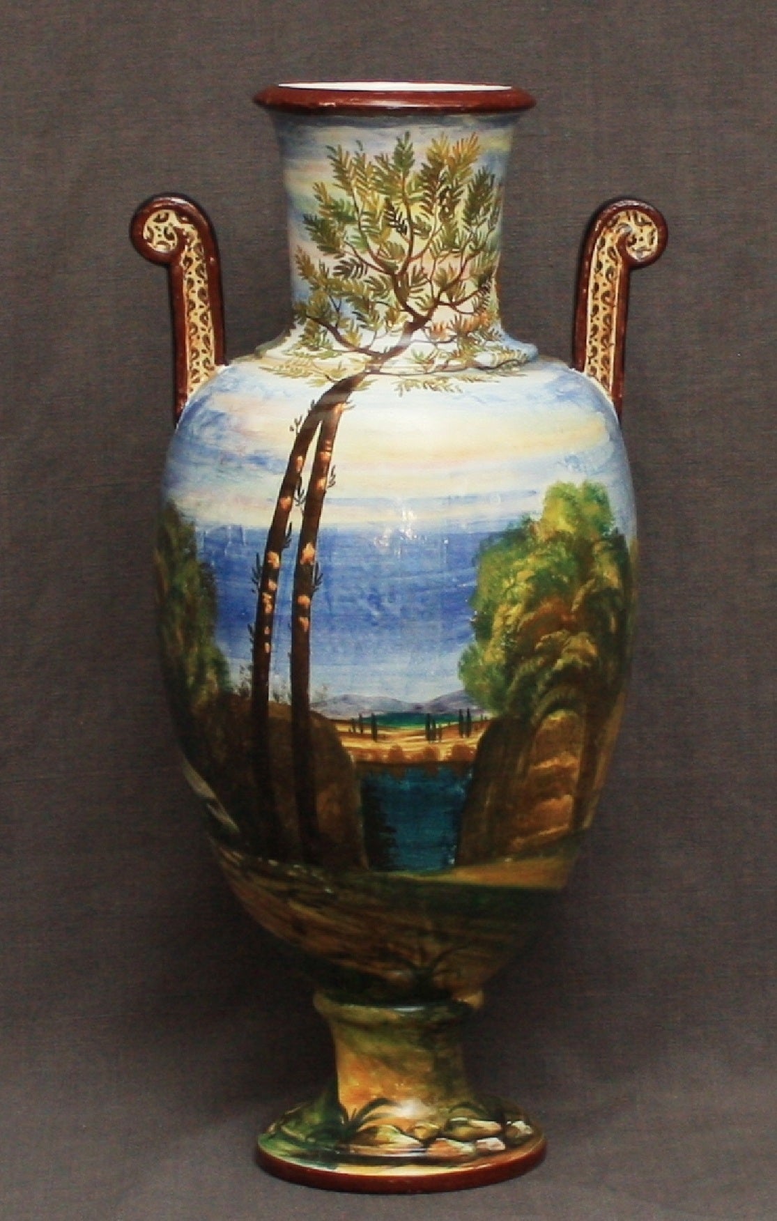 Mid-century Etruscan-style urn with painted scenes along the Amalfi coast with mythological figures on reverse.  Italy, circa 1940.
Dimension: 4.75" base diameter x 8.5" handle to handle x 17.25" height.
